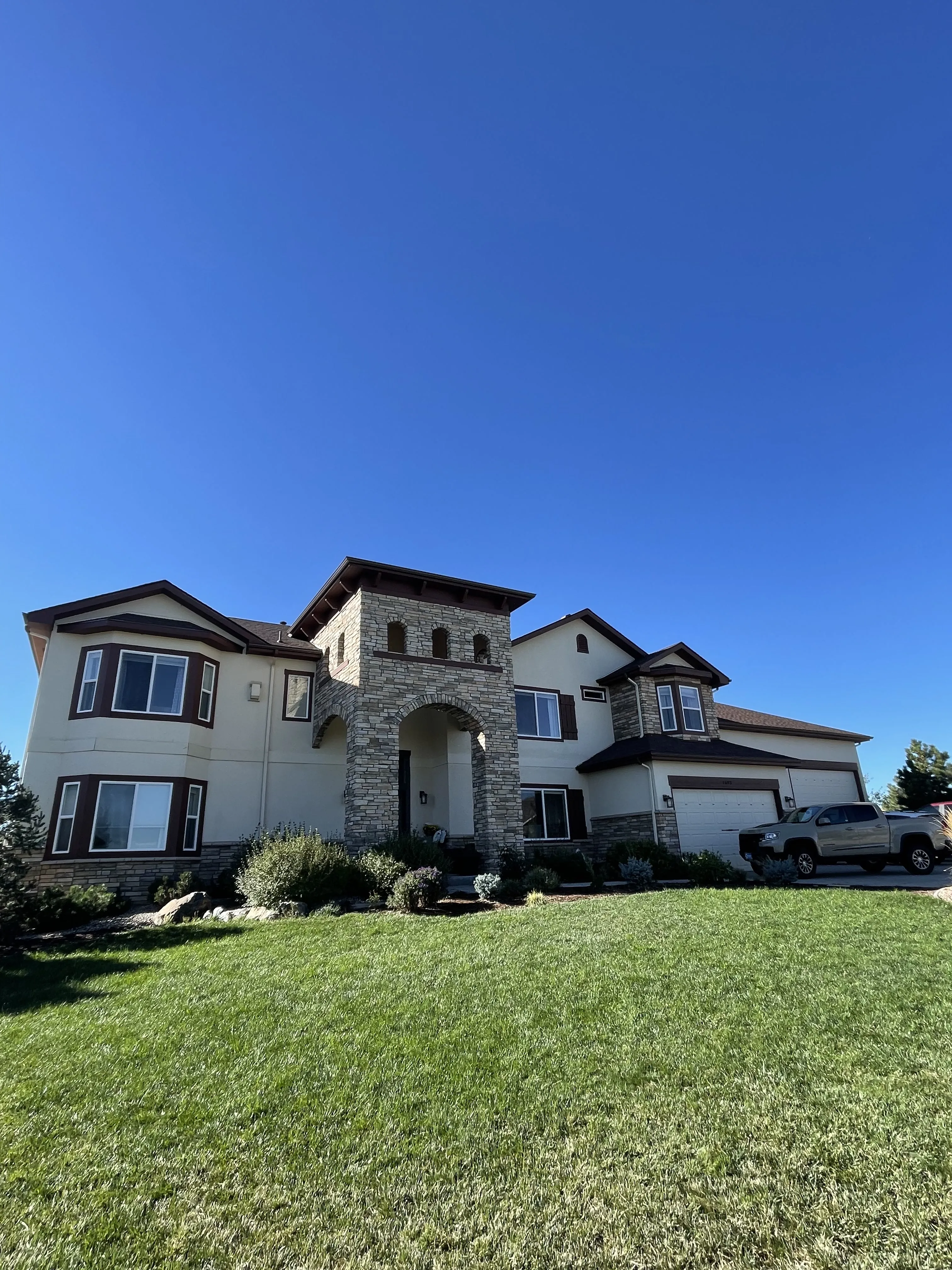 Exterior painting — stone and stucco home in the Southern Denver Metro