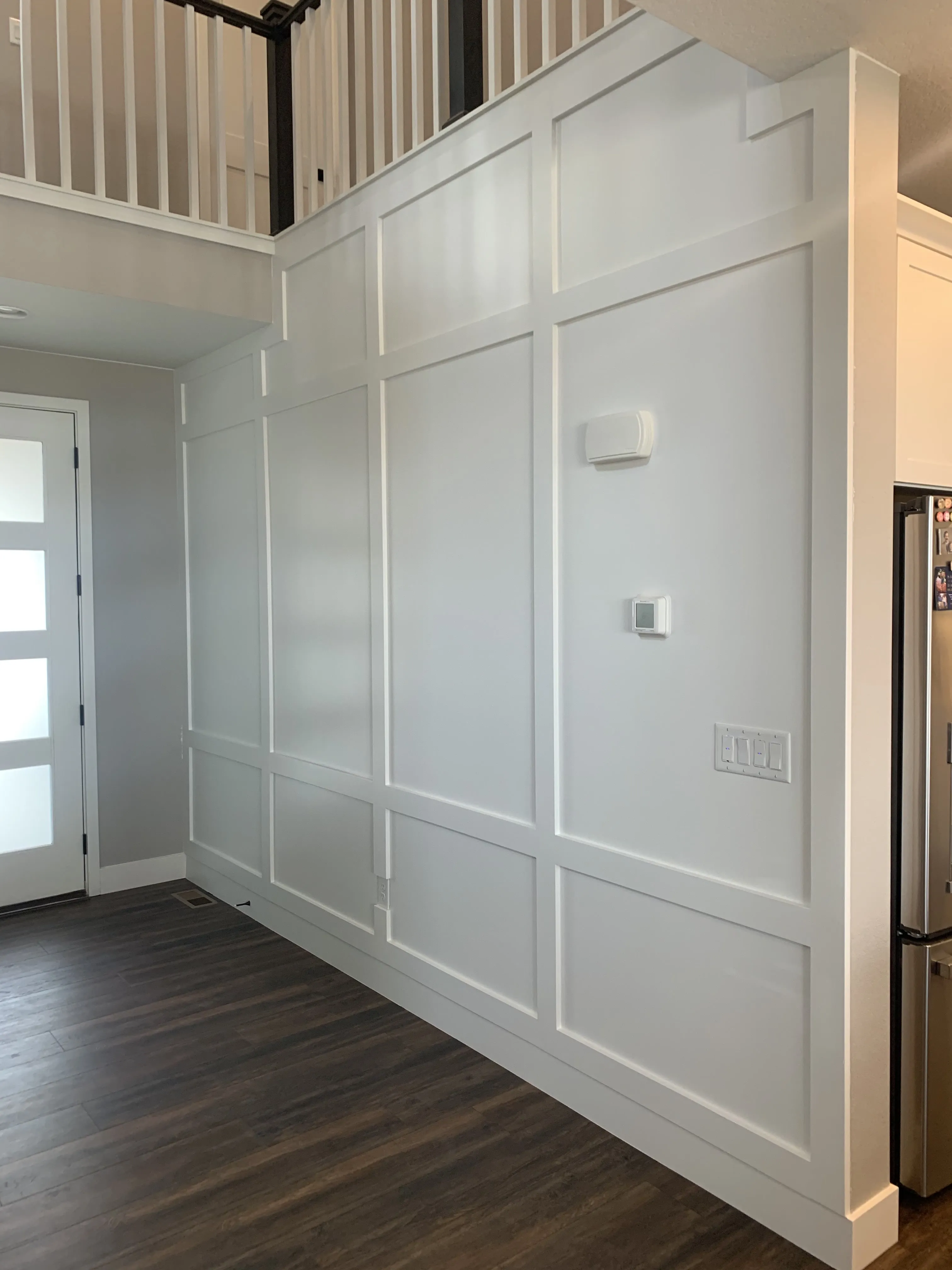 Interior trim and board-and-batten wainscot painted white