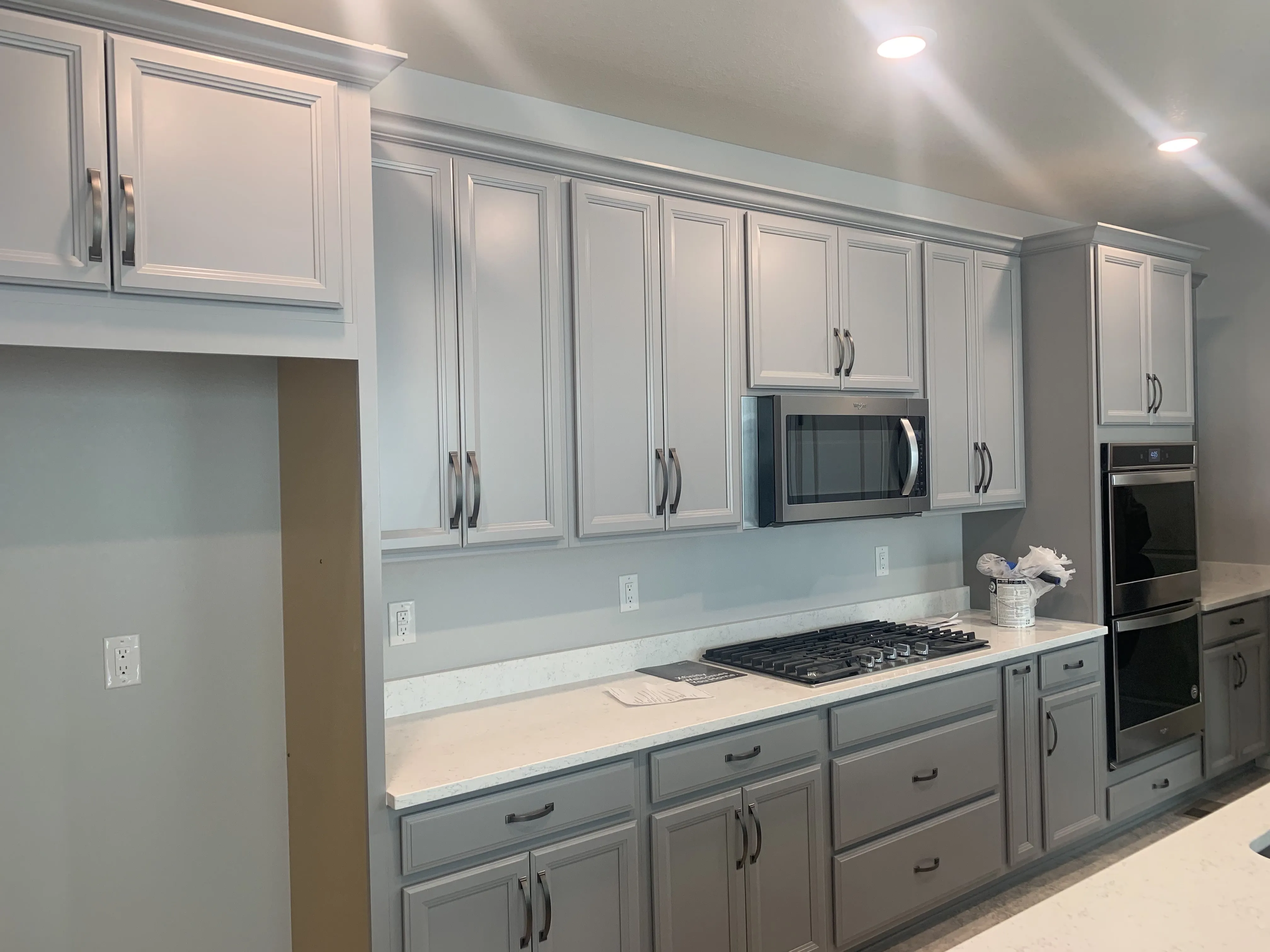 Cabinet painting — two-tone grey and white kitchen